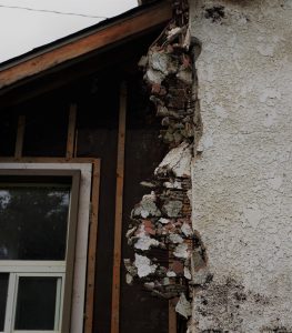Asbestos revealed in broken wall
